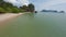 Aerial view empty tropical sand beach coastline sea ocean cliff rock covered by greenery landscape