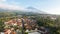 Aerial view of Enjoy the morning with the expanse of rice fields and views of Mount Ciremai. Kuningan, West Java, Indonesia, July