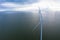 Aerial view, Enormous windmills stand in the sea along a dutch sea. FryslÃ¢n wind farm.