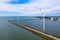 Aerial view, Enormous windmills stand in the sea along a dutch sea. FryslÃ¢n wind farm, the largest inland wind farm.