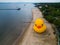 Aerial view of an enormous yellow rubber duck on the beach near the ocean in Rye Beach, New York