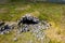 Aerial view of the entrance to an underground cave system on remote moorland