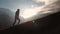 Aerial view of epic shot of a man walking on the edge of the mountain as a silhouette in a beautiful sunset. Silhouette