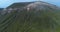 Aerial view of Etna volcano. From the feet to the top. Huge mountain in a summer journey, with vegetation in the