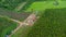 Aerial view of excavators are working on the foundations of high-voltage pylons and the legs of high-voltage poles. Top view of