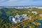 Aerial view of an Exhibition center and 83 Tower behind an artificial lake in Daegu, Republic of Korea