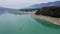 Aerial View Exposed dead tree in turquoise water of lake Embalse de Yesa, Spain