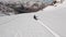 Aerial view extreme man snowboard downhill freeride on snowy mountain frozen natural landscape