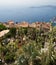 Aerial view on `Eze` city terracotta rooftops and blue mediterranean sea. Eze, French Riviera, France.