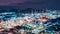 Aerial view of factory zone Oil and gas industry - refinery stores tank and Petrochemical plant on island at twilight over