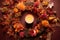 aerial view of a fall wreath with a cozy candle centerpiece