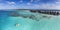 Aerial view of a family on a pedalo boat ride in the Maldives