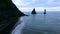 Aerial view of the famous black Icelandic beach and cliffs. Andreev.