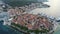 Aerial view of famous Croatian island Korcula, with mediterranean architecture, marina and luxury yachts and sailboats embarked.