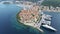 Aerial view of famous Croatian island Korcula, with mediterranean architecture, marina and luxury yachts and sailboats embarked.
