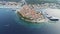 Aerial view of famous Croatian island Korcula, with mediterranean architecture, marina and luxury yachts and sailboats embarked.