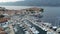 Aerial view of famous Croatian island Korcula, with mediterranean architecture, marina and luxury yachts and sailboats embarked.