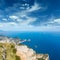 Aerial view of famous Faraglioni rocks from Monte Solaro at Capri island, Italy.