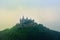 Aerial view of famous Hohenzollern Castle at foggy spring or summer day