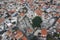 Aerial view of famous landmark valley Pano Lefkara village, Larnaca, Cyprus with orange ceramic roofs, drone photo