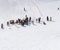 Aerial view famous ski resort. Skiers skiing on the mountain. Ski lift. Family sports weekend, holidays in the snow mountains