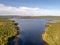 Aerial view famous waterfall Tannforsen northern Sweden, with a rainbow in the mist and rapid flowing cascades of water