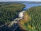 Aerial view famous waterfall Tannforsen northern Sweden, with a rainbow in the mist and rapid flowing cascades of water