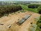 Aerial view of a farm camp, diagonal view of a large silage heap