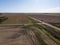 Aerial View of Farm Fields and Double Train Tracks Across Prairie