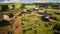 An aerial view of a farm with a herd of sheep