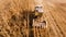 Aerial view of farmer using tractor, harvesting combine and tools to harvest