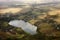 Aerial view of farmland area landscape and lake from airplane. Landscape with lake. view of the village from the sky