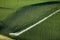 An aerial view of farmland irrigated with center pivot sprinkler systems.