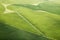 An aerial view of farmland irrigated with center pivot sprinkler systems.