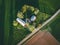 Aerial view of farmland with red barn and houses and harvest field in Finland