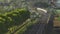 Aerial view of fast passenger train driving on railroad. High angle view of passing high speed train in rural summer