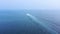 Aerial view of fast speed boat gliding on the water surface