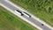 Aerial view of a fast trucks on the road in countryside