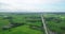 Aerial view of Fields with various types of agriculture and Irrigation canal in rural Thailand