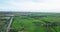 Aerial view of Fields with various types of agriculture and Irrigation canal in rural Thailand