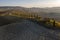 Aerial view of the fields, wineries near San Quirico d`Orcia. Tuscany autumn sunrise