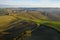 Aerial view of the fields, wineries near San Quirico d`Orcia. Tuscany autumn sunrise