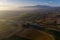 Aerial view of the fields, wineries near San Quirico d`Orcia. Tuscany autumn sunrise