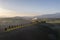 Aerial view of the fields, wineries near San Quirico d`Orcia. Tuscany autumn sunrise