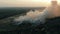 Aerial view at fire at garbage dump, burning pollutes the environment. Ecological catastrophe and destruction of nature