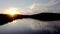 Aerial view of fisherman at the boat on golden sunset river. silhouette of fishermen with his boat, Fisherman life style