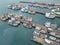 Aerial view of fisherman dock which has many ships anchoring for transport seafood and supplies