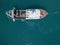 Aerial view of a fishing boat approaching the quay, waiting to moor