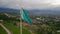 aerial view of the flag of Kazakhstan on the background of the mountains