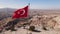 Aerial view of flag of Turkey in Cappadocia. Slow motion